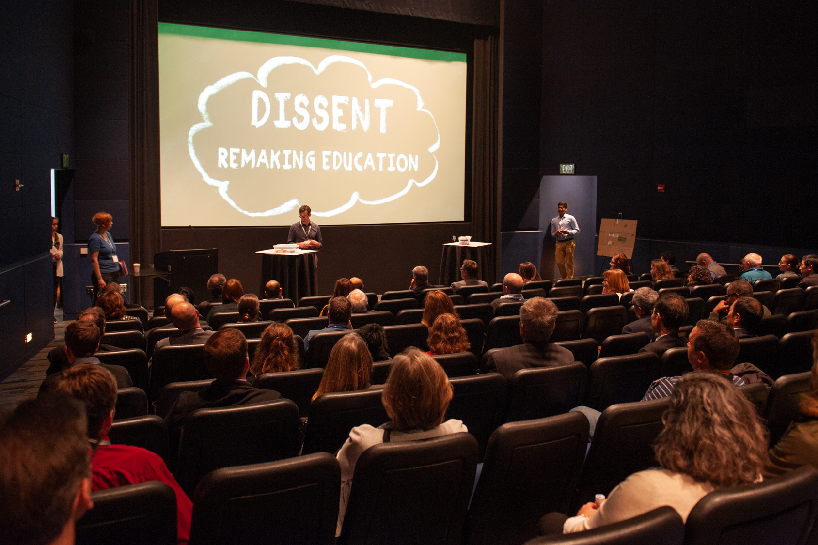 Dissent participants gather in an auditorium for an overview of the session.